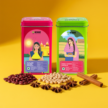Two colorful Kiwi brand spice tins on a yellow background with spices in front.