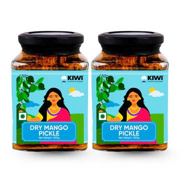 A glass jar filled with chunks of Dry Mango Pickle, showing green mango pieces in oil and spices.