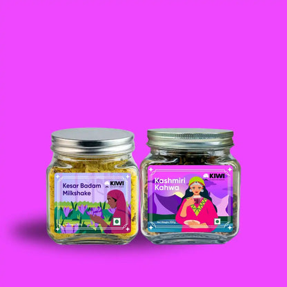 Glass bottle of Kashmiri Beverages Milkshake+Kahwa with green leaves and a spoon.