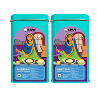 Amritsari Paratha Masala spice blend in a clear jar with a brown lid, showing a vibrant mix of spices.